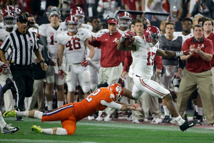 Alabama's Kenyan Drake gets past Clemson kicker Greg Huegel as he runs back a kick off for a touchdown during the second half of the NCAA college football playoff championship game Monday Jan. 11 2016 in Glendale Ariz