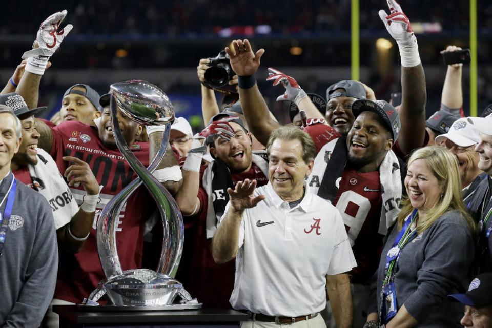 Alabama head coach Nick Saban joins the team in celebration after the Cotton Bowl NCAA college football semifinal playoff game against Michigan State Thursday Dec. 31 2015 in Arlington Texas. Alabama won 38-0 to advance to the championship game. (AP