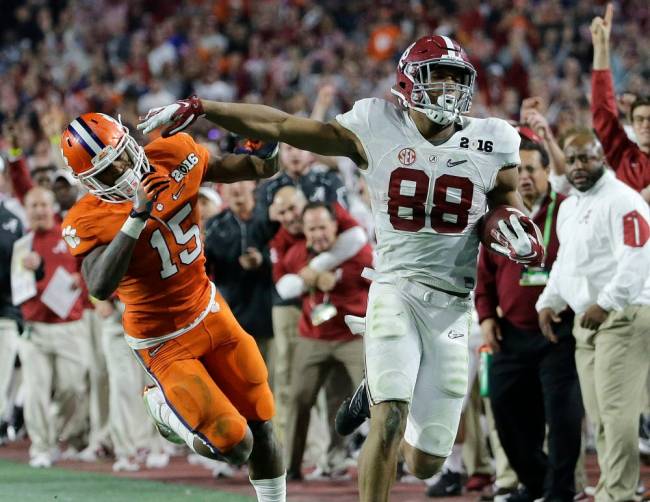 Clemson's T.J. Green knocks Alabama's O.J. Howard out of bounds after a catch during the second half of the NCAA college football playoff championship game Monday Jan. 11 2016 in Glendale Ariz