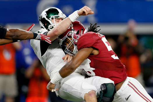 ARLINGTON TX- DECEMBER 31 Tim Williams #56 of the Alabama Crimson Tide sacks Connor Cook #18 of the Michigan State Spartans in the second half during the Goodyear Cotton Bowl at AT&T Stadium