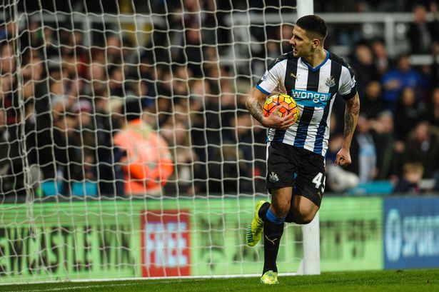 Aleksandar Mitrovic of Newcastle picks the ball out of the net after Georginio Wijnaldum scored Newcastle's goal