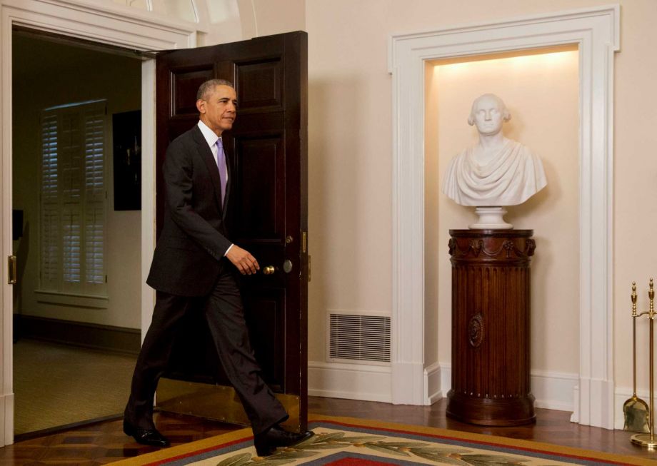 President Barack Obama enters the Cabinet Room of the White House to speak about the release of Americans by Iran Sunday Jan. 17 2016 in Washington