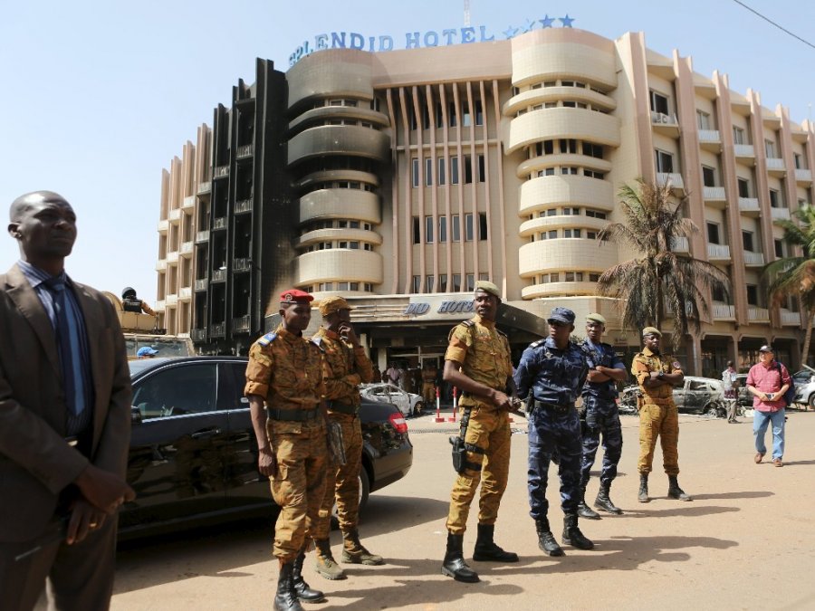 Soldiers stand guard in front of the Splendid Hotel after an attack on the hotel and a restaurant in Ouagadougou Burkina Faso