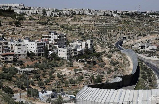 An Israeli road cuts into the Palestinian city of Beit Jala site of the most recent Israeli raids