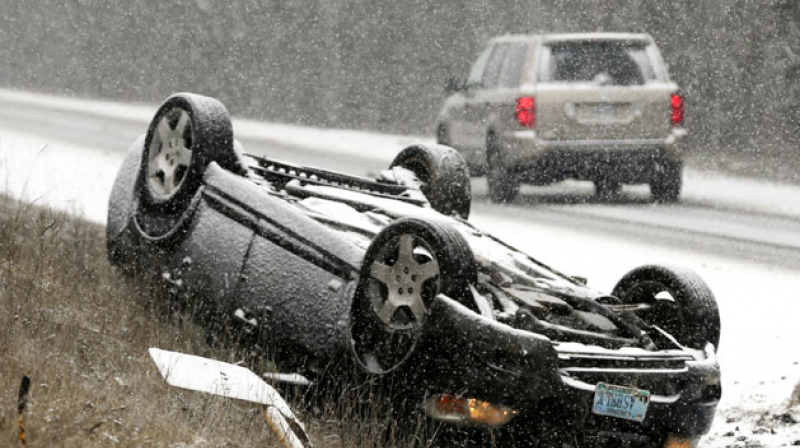 An overturned vehicle after blizzard'Snowzilla strikes US East Coast on Saturday