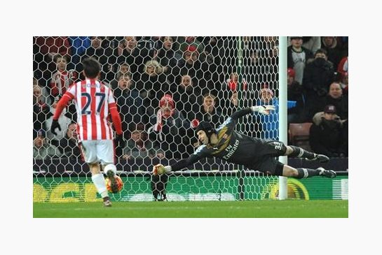 Arsenal’s goalkeeper Petr Cech saves a long range shot during the English Premier League soccer match between Stoke City and Arsenal at the Britannia Stadium Stoke on Trent England Sunday Jan. 17 2016