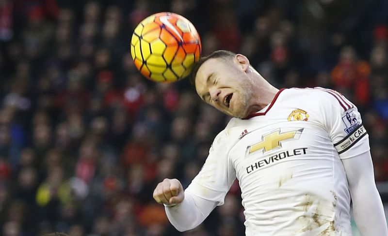 Manchester United's Wayne Rooney heads the ball during the Barclays Premier League football match against Liverpool at Anfield. – Reuters pic