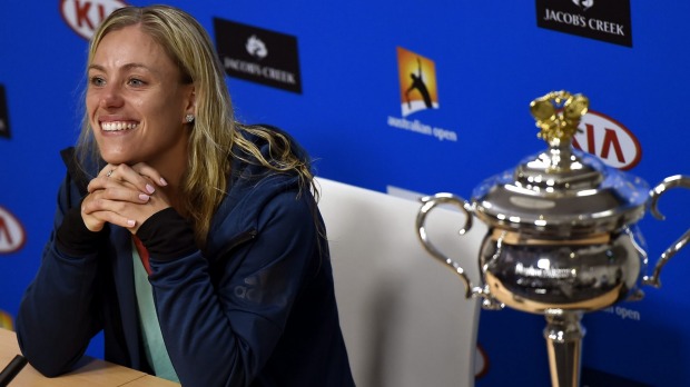 Angelique Kerber of Germany beams during a press conference following her win over Serena Williams