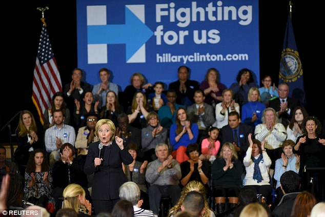 As her campaign machinery grinds in Iowa Hillary Clinton speaks at Hillside town hall meeting in Manchester New Hampshire on Friday