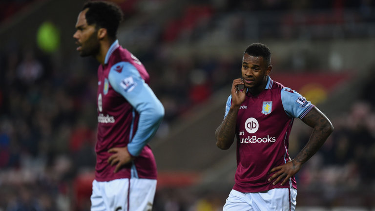 Aston Villa players Joleon Lescott and Leandro Bacuna look dejected during the defeat