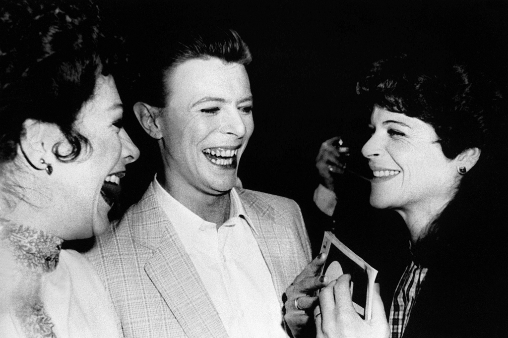 British singer David Bowie who played John Merrick in'The? Elephant Man on broadway and co-stard Patricia Elliott are congratulated by Gilda Radner