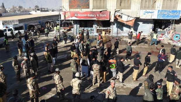 Pakistani security officials examine the site of a bomb blast near a polio vaccination centre in Quetta on Wednesday outside a police outside a polio vaccination centre