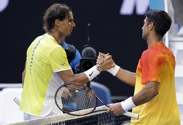 Rafael Nadal left of Spain congratulates compatriot Fernando Verdasco after their first round match at the Australian Open tennis championships in Melbourne Australia Tuesday