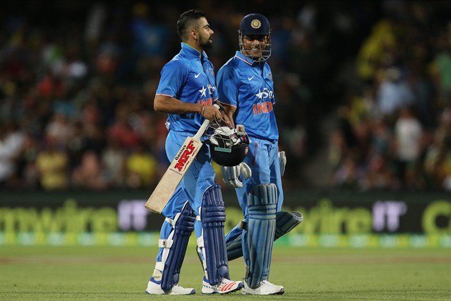 India's Virat Kohli left an MS Dhoni react during their T20 International cricket match against Australia in Adelaide Australia Tuesday Jan 26 2016