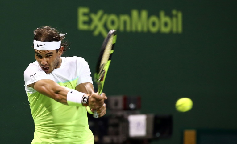 Spain's Rafael Nadal returns the ball during a match against Andrey Kuznetsov of Russia at Qatar Open tennis tournament Thursday Jan. 7 2016 in Doha Qatar