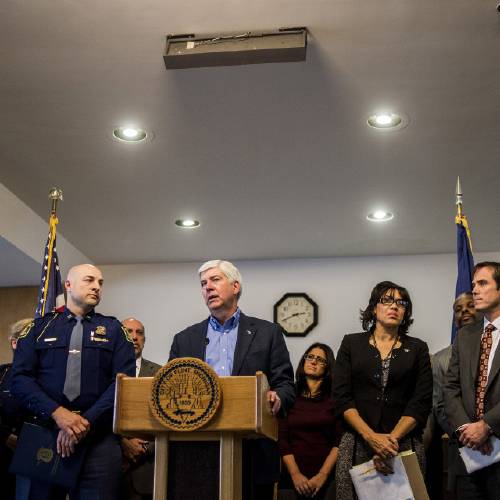 Rick Snyder speaks during a news conference in Flint Mich. Monday Jan. 11 2016. Snyder pledged Monday that officials would make contact with every household in Flint to check whether residents have bottled water and a filter and