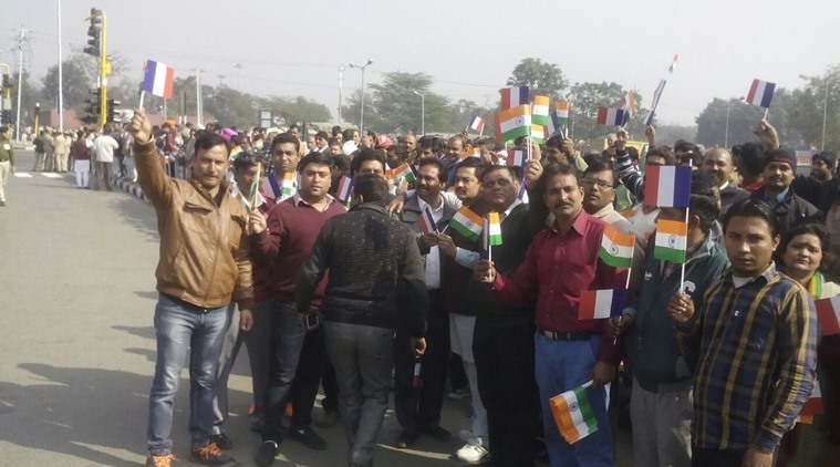 BJP workers gather at a traffic intersection in Chandigarh waiting to greet President Hollande. Express