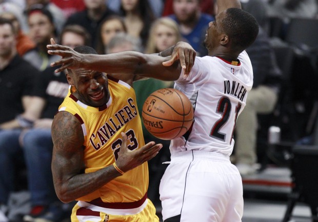 Portland Trail Blazers forward Noah Vonleh knocks the ball away from Cleveland Cavaliers forward Le Bron James during the second half of an NBA basketball game in Portland Ore. Saturday Dec. 26 2015