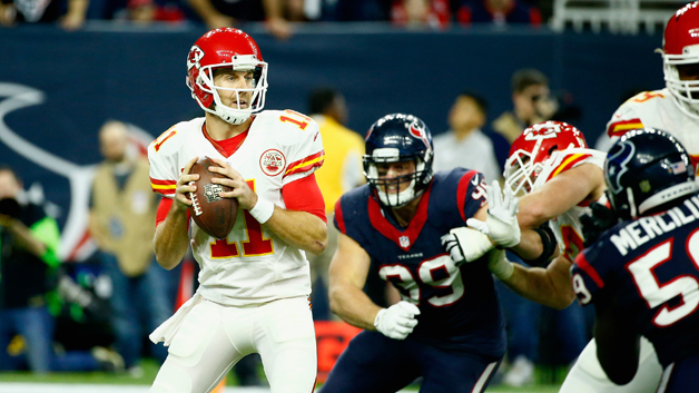 HOUSTON TX- JANUARY 09 Quarterback Alex Smith #11 of the Kansas City Chiefs looks to pass against the Houston Texans during the AFC Wild Card Playoff game at NRG Stadium