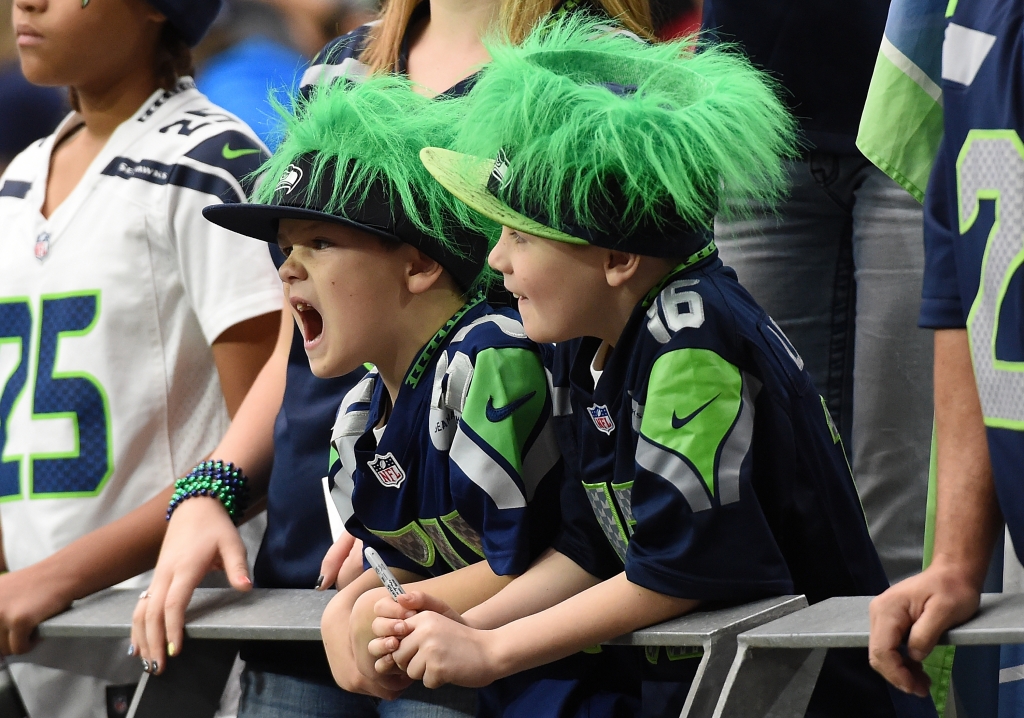 GLENDALE AZ- JANUARY 03 Young Seatle Seahawks fans react from the stands prior to the NFL game against the Arizona Cardinals at University of Phoenix Stadium