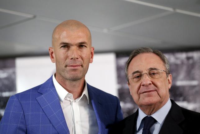 Real Madrid's new coach Zinedine Zidane and Real Madrid's President Florentino Perez pose for the media at Santiago Bernabeu stadium in Madrid Spain