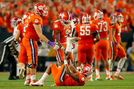 Deshaun Watson No.4 of the Clemson Tigers lies on the turf in the third quarter against the Alabama Crimson Tide during the 2016 College Football Playoff National Championship Game at University of Phoenix Stadium on Tuesday in Glendale Arizona. AFP PHOT