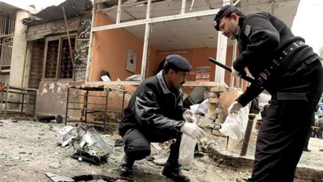 Pakistan police inspect the area after a bomb blast killed at least fifteen people outside a polio vaccination center in Pakistan’s southwestern city of Quetta