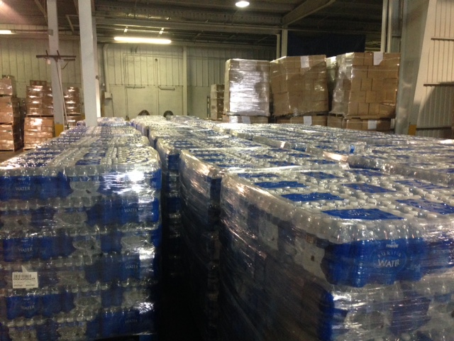 Bottled water is loaded into a warehouse in Flint before delivery to residents