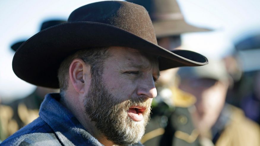 Ammon Bundy speaks with reporter at a news conference at Malheur National Wildlife Refuge Friday Jan. 8 2016 near Burns Ore. Bundy the leader of an armed group occupying the national wildlife refuge to protest federal land management policies said F