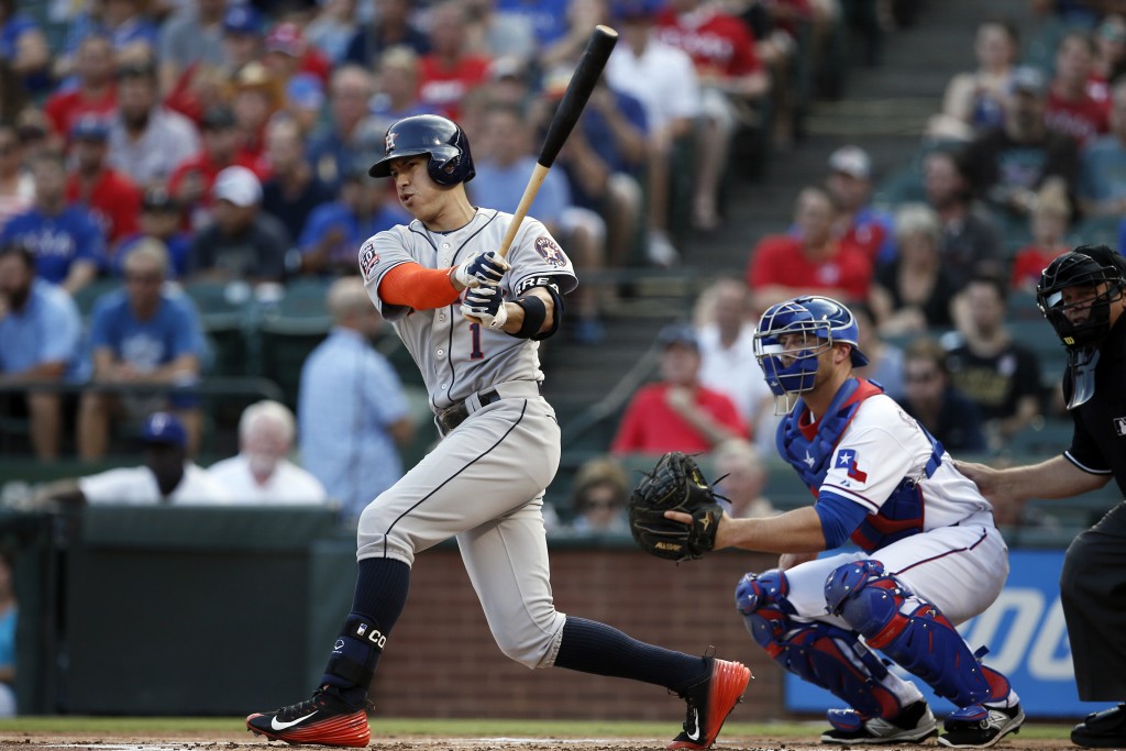 Houston Astros shortstop follows through on a swing