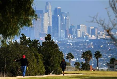 Hikers walk along a path at the Kenneth Hahn State Recreation Area near downtown Los Angeles on Sunday Jan. 3 2016. Southern California is bracing for a series of storms expected to begin late Sunday that could last all week