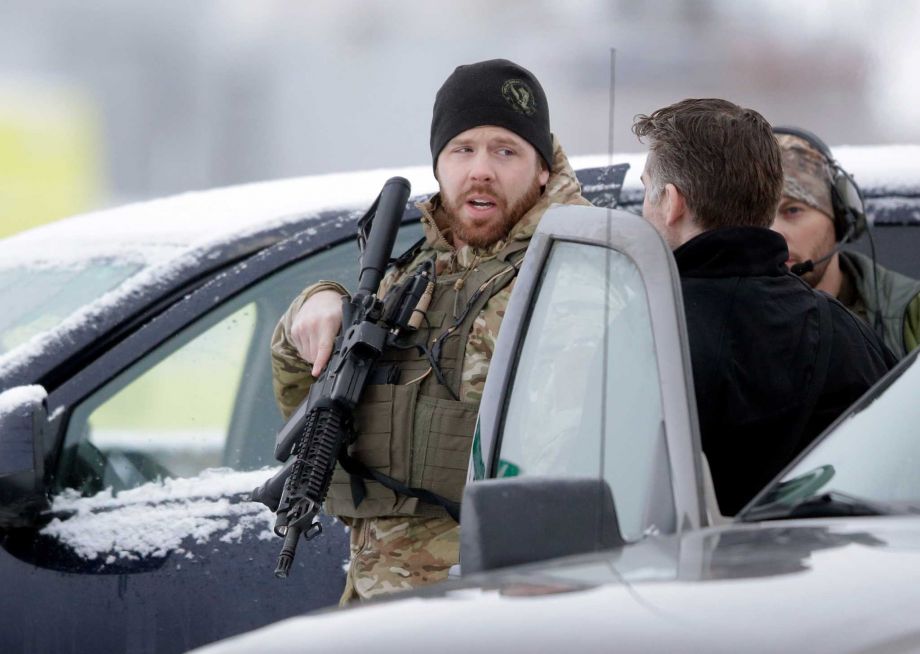 Members of the FBI stand guard at the Burns Municipal Airport Sunday Jan. 10 2016 in Burns Ore. A small armed group has been occupying a remote national wildlife refuge in Oregon since a week earlier to protest federal land use policies