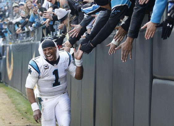 Cam Newton celebrates with fans after the second half of an NFL divisional playoff football game against the Seattle Seahawks Sunday Jan. 17 2016 in Charlotte N.C. The Panthers won 31-24. (AP