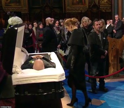 Celine Dion greets mourners in Rene Angelil's open casket viewing