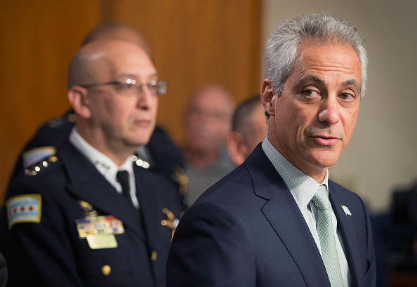 Interim Chicago Police Superintendent John Escalante listens as Chicago Mayor Rahm Emanuel addresses changes in training and procedures that will take place at the Chicago police department in the wake of recent shootings