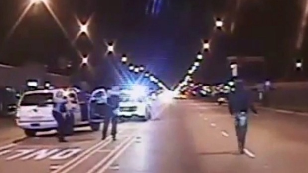 Laquan Mc Donald walks on a road before he was shot 16 times by police officer Jason Van Dyke in Chicago in this still image taken from a police vehicle dash camera video