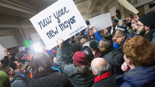 Chicago protesters call for the resignation of Mayor Rahm Emanuel during a rally outside his office