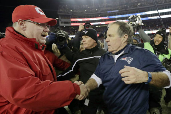 Kansas City Chiefs head coach Andy Reid, and New England Patriots head coach Bill Belichick meet at midfield after an NFL divisional playoff football game. The Patriots won 27-20