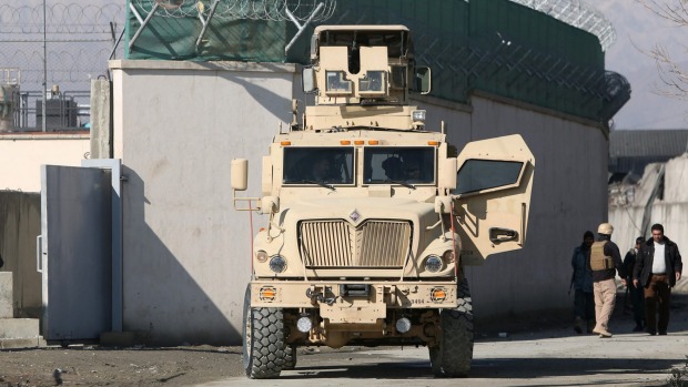 A US military vehicle blocks a road to a logistics company near the site of a deadly suicide attack in Kabul earlier this month. The Taliban claimed responsibility for the attack