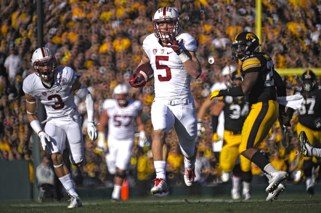 ASSOCIATED PRESS           Stanford running back Christian Mc Caffrey scores against Iowa during the first half of the Rose Bowl NCAA college football game today in Pasadena Calif