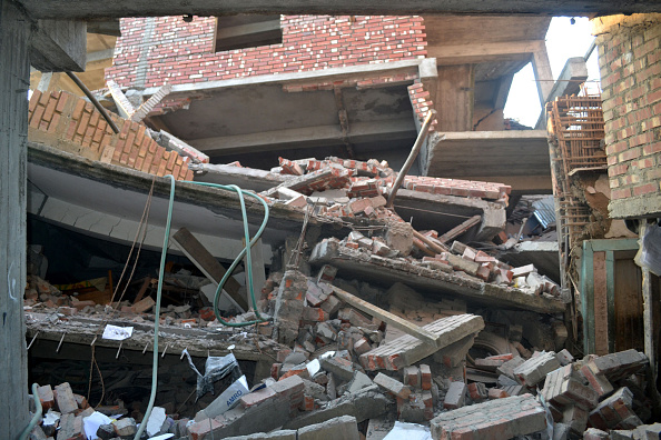 Collapsed houses at Imphal capital of northeastern India state Manipur