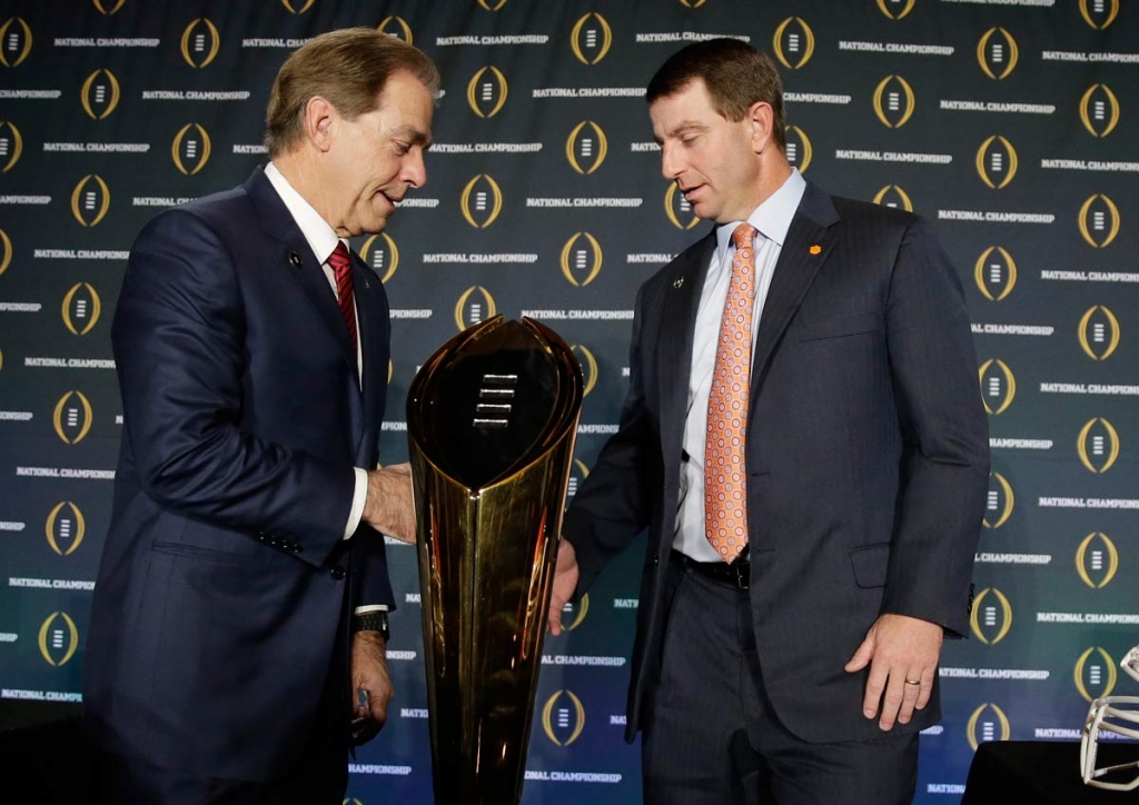 Clemson head coach Dabo Swinney and Alabama head coach Nick Saban shake hands after a news conference for the NCAA college football playoff championship game Sunday Jan. 10 2016 in Glendale Arizona