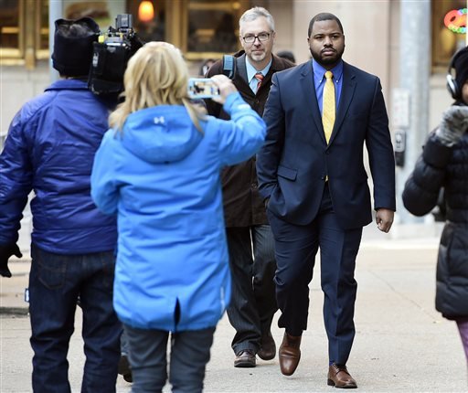 Officer William Porter right arrives at Courthouse East with his attorneys Wednesday Jan. 6 2016 in Baltimore. Circuit Judge Barry Williams is holding a motions hearing Wednesday ahead of the trial for Caesar Goodson who drove the police transport