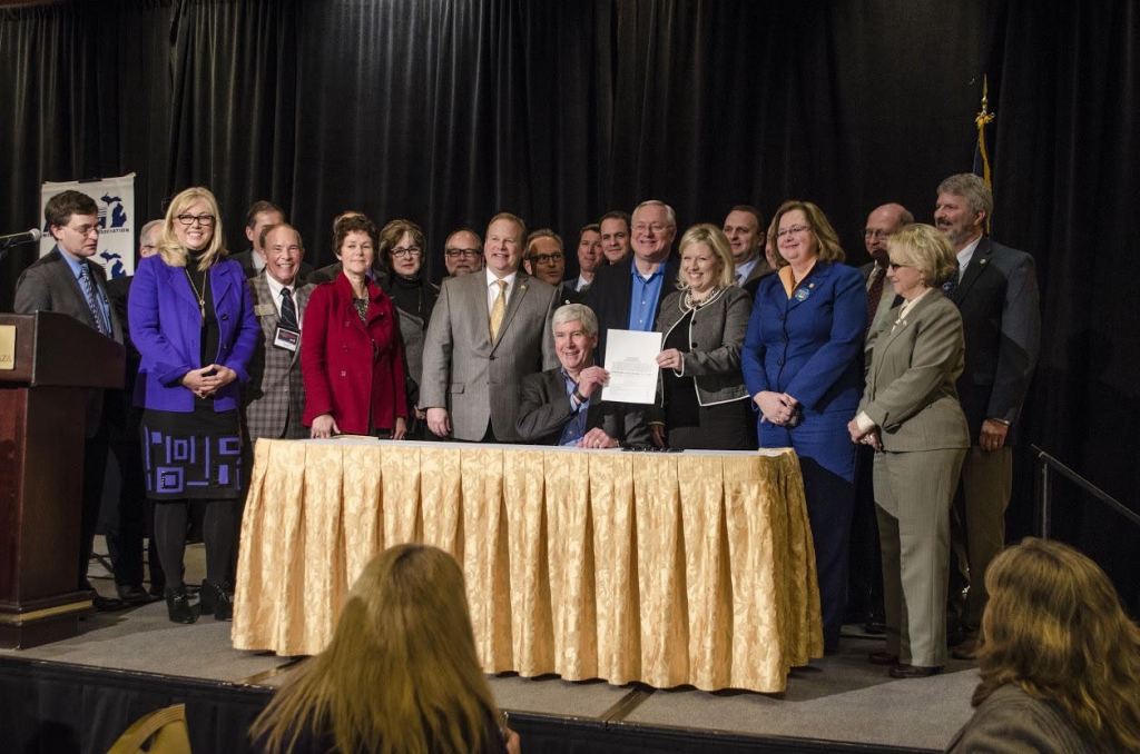 Gov. Snyder signs a bill that secures $28 million in aid to Flint