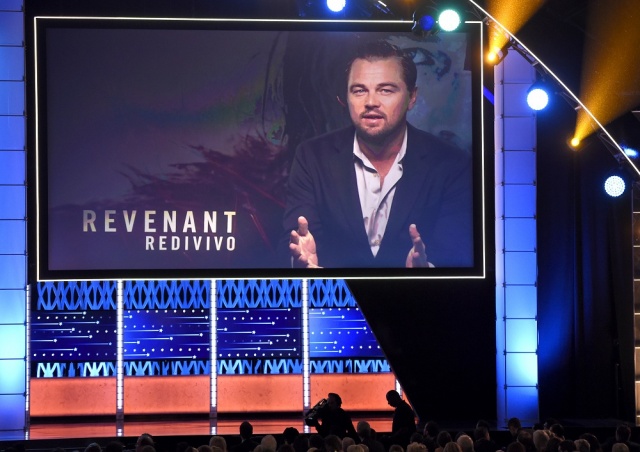 Leonardo Di Caprio is seen on screen accepting the award for best actor for “The Revenant” at the 21st annual Critics Choice Awards at the Barker Hangar on Sunday in Santa Monica Calif