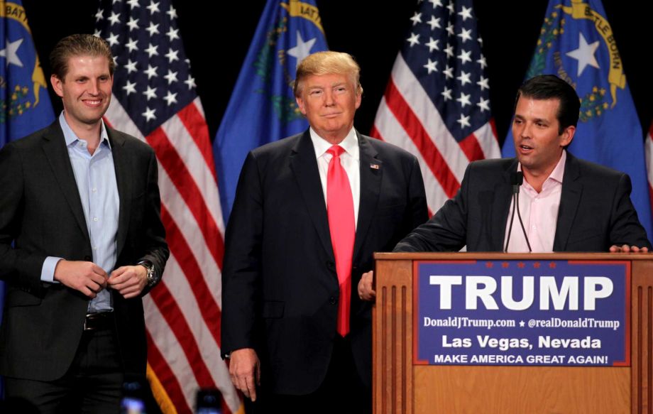 Donald Trump Jr. right with his father Republican presidential candidate Donald Trump center and his brother Eric Trump left during a campaign rally on Thursday Jan. 21 2016 in Las Vegas