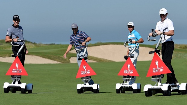 Henrik Stenson Jordan Spieth Rickie Fowler and Rory Mc Ilroy riding'golfboards at Saadiyat Beach Golf Club before the Abu Dhabi Championship