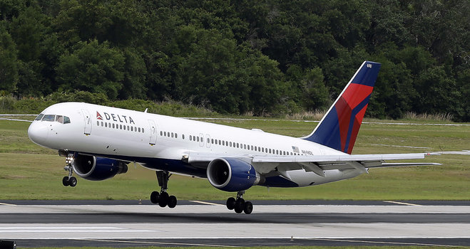 Delta Air Lines Boeing 757-232 lands at Tampa International Airport in Tampa Fla. Delta reports quarterly financial results on Tuesday Jan. 19 2016