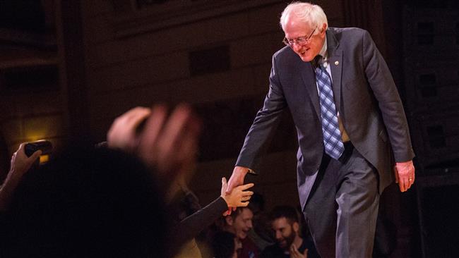 Democratic presidential candidate Sen. Bernie Sanders shakes hands with supporters after outlining his plan to reform the US financial sector