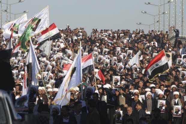 Supporters of Shiah cleric Moqtada al Sadr protest against the execution of Shiah Muslim cleric Nimr al Nimr in Saudi Arabia during a demonstration in Najaf Iraq